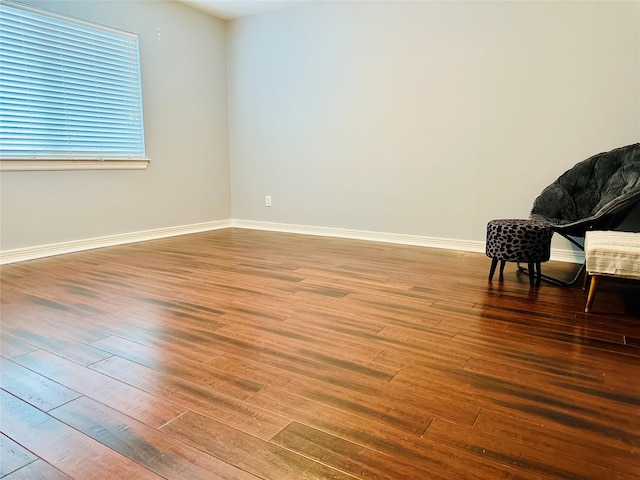 spare room with hardwood / wood-style flooring