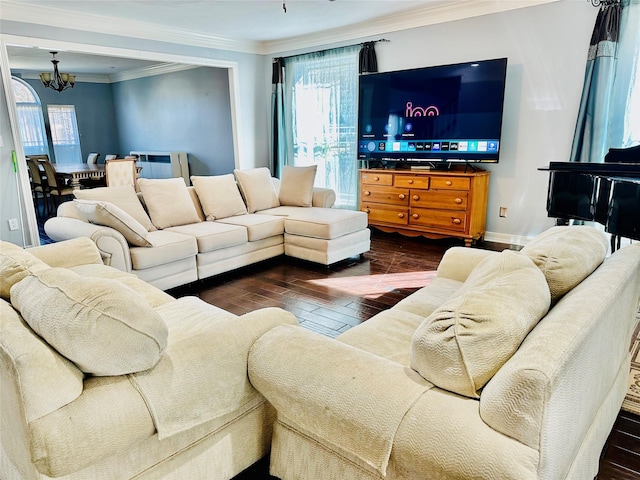 living room featuring crown molding, dark hardwood / wood-style floors, and an inviting chandelier