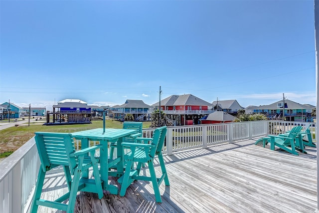 wooden deck with a yard