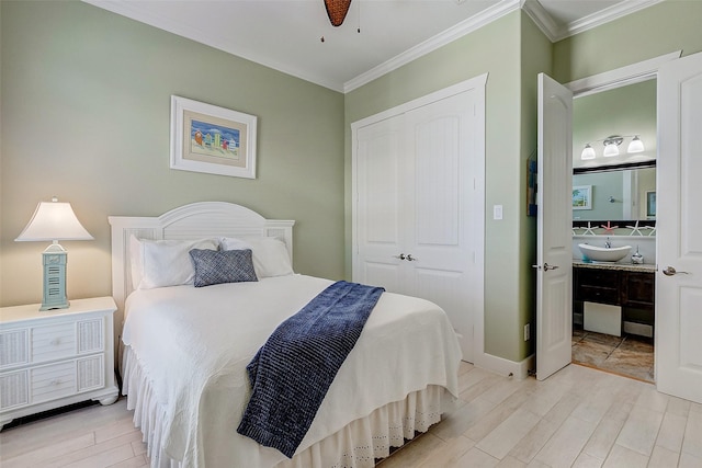 bedroom with ceiling fan, a closet, and crown molding