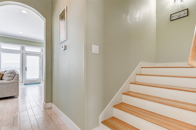 stairway with hardwood / wood-style floors