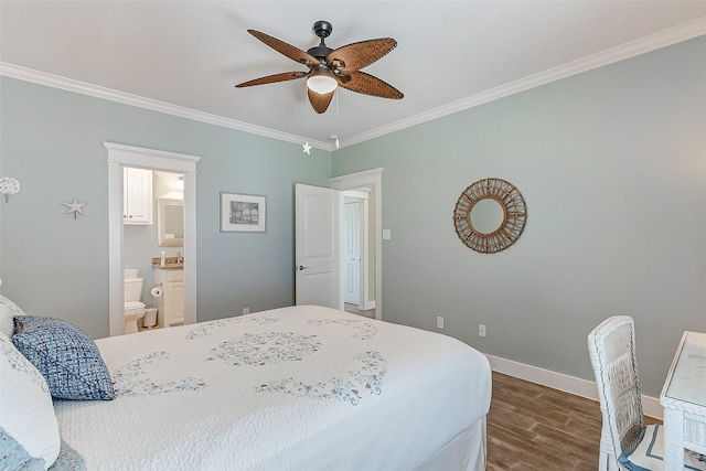 bedroom featuring ceiling fan, ensuite bath, ornamental molding, and hardwood / wood-style flooring