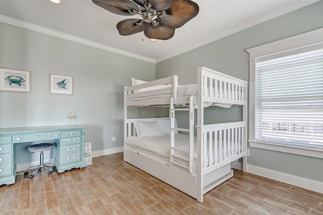 bedroom with ceiling fan, ornamental molding, and light hardwood / wood-style flooring