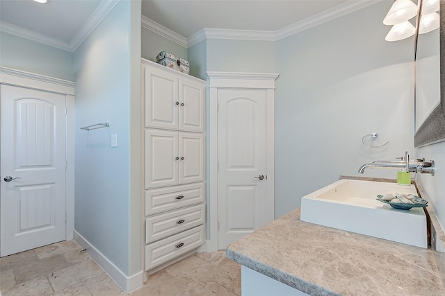 bathroom with vanity and ornamental molding