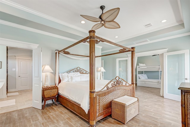 bedroom with ceiling fan, wood-type flooring, and crown molding