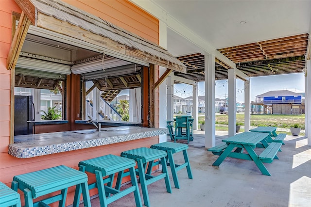 view of patio with a wet bar