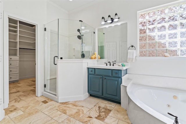 bathroom featuring vanity, ornamental molding, and independent shower and bath