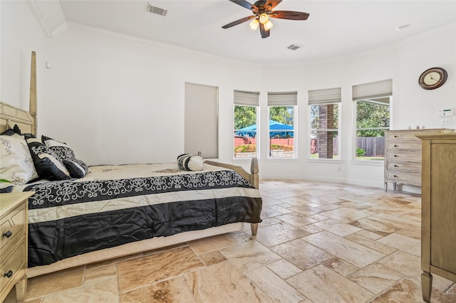 bedroom with ornamental molding and ceiling fan