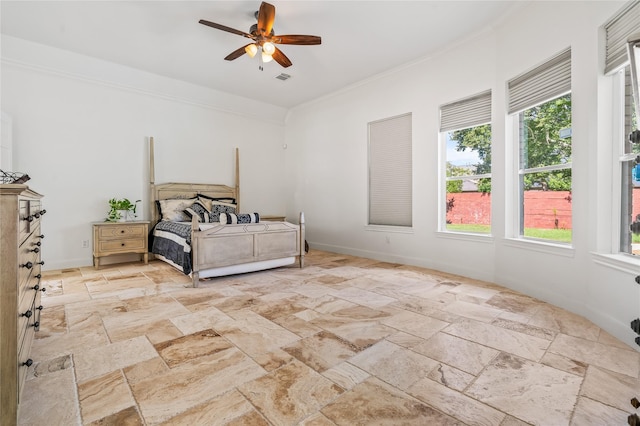 bedroom with ornamental molding and ceiling fan