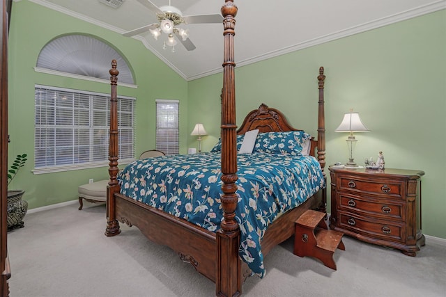 bedroom featuring ceiling fan, ornamental molding, vaulted ceiling, and carpet