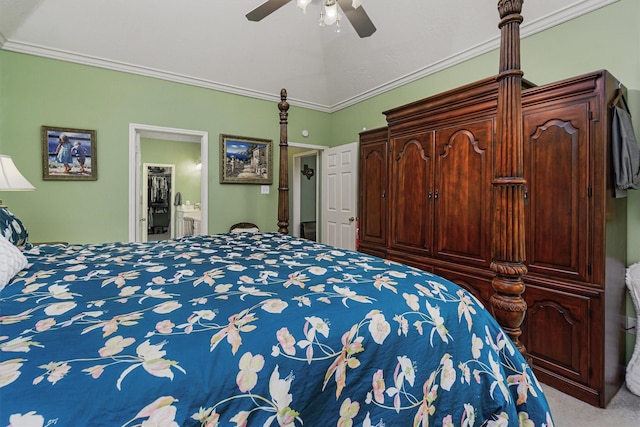 carpeted bedroom featuring connected bathroom, ornamental molding, and ceiling fan