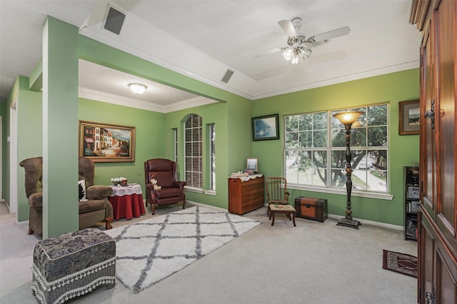 sitting room featuring crown molding, light colored carpet, and ceiling fan