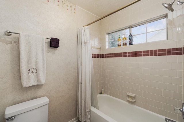 bathroom with shower / tub combo with curtain and toilet