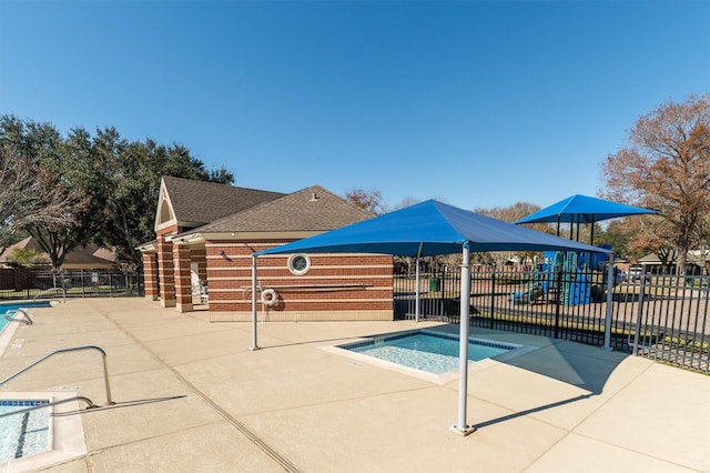 view of pool featuring a patio area and a hot tub