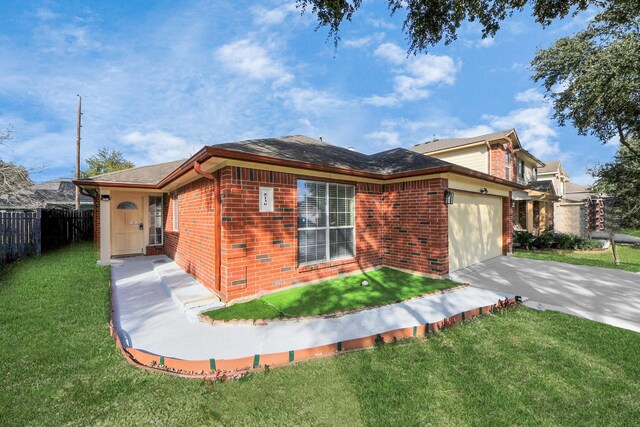 view of front of home with a garage and a front lawn