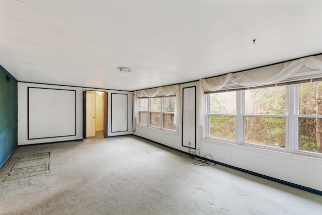 unfurnished bedroom featuring light colored carpet