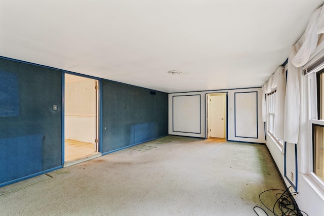 empty room featuring light carpet