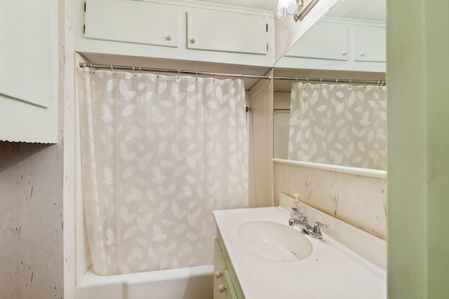 bathroom featuring shower / tub combo and vanity