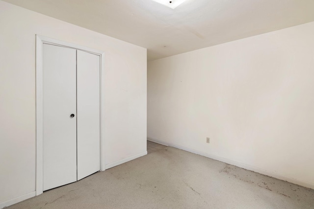 unfurnished bedroom with a closet