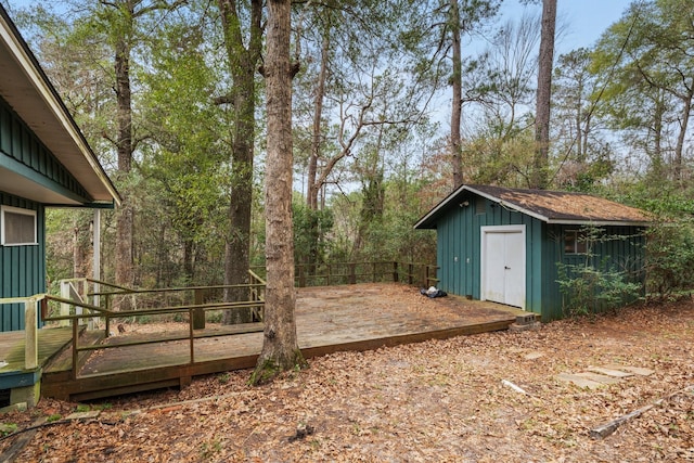 view of yard featuring a deck and a shed