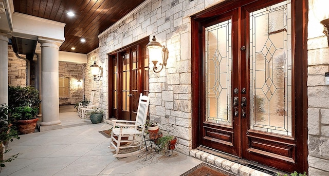 property entrance featuring french doors