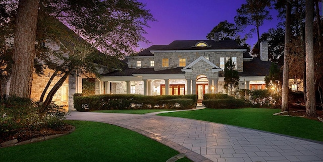 view of front of home with a yard