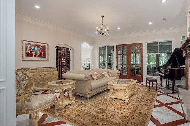 living room with crown molding, french doors, and an inviting chandelier