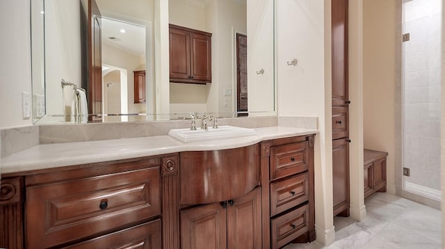 bathroom with vanity and ornamental molding