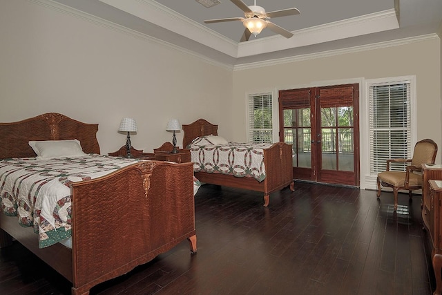 bedroom with dark hardwood / wood-style flooring, french doors, access to exterior, a raised ceiling, and ceiling fan