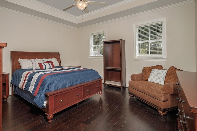 bedroom featuring ceiling fan, ornamental molding, and dark hardwood / wood-style floors