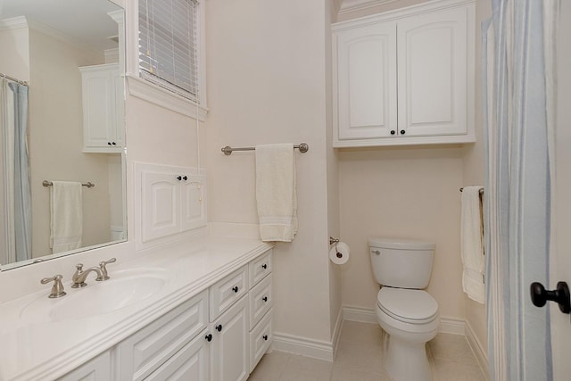 bathroom featuring tile patterned floors, vanity, crown molding, and toilet