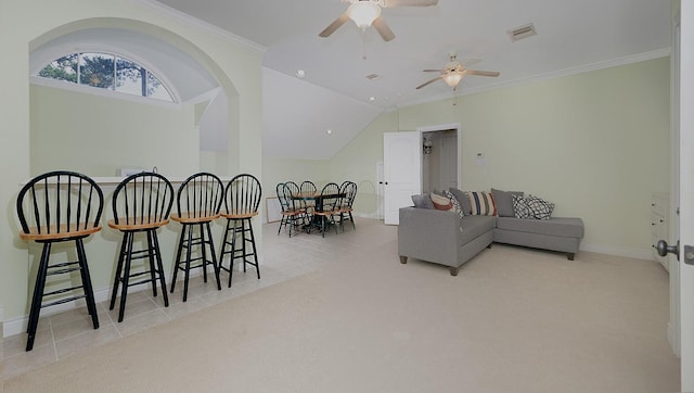 living room featuring vaulted ceiling, ceiling fan, light tile patterned floors, and crown molding