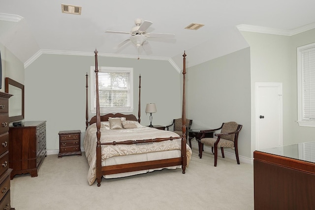 carpeted bedroom featuring ceiling fan, lofted ceiling, and ornamental molding