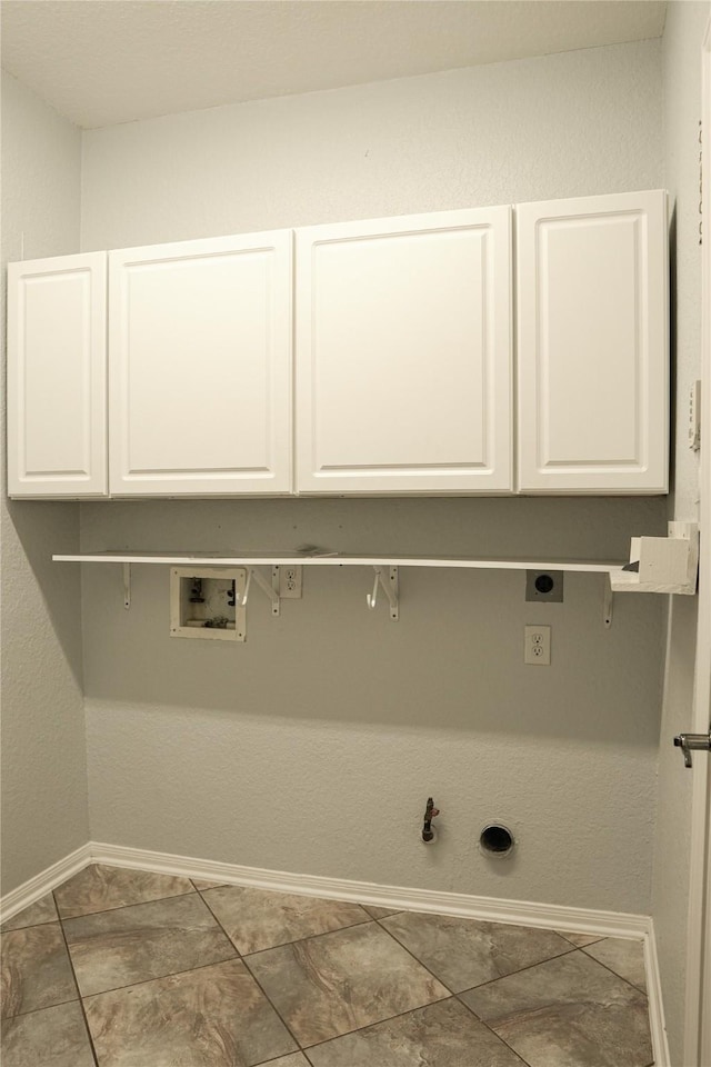 laundry room featuring washer hookup, hookup for a gas dryer, hookup for an electric dryer, and cabinets