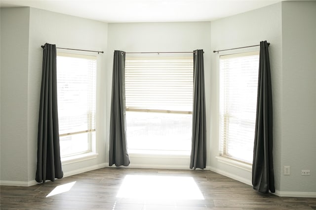 unfurnished room featuring dark hardwood / wood-style flooring