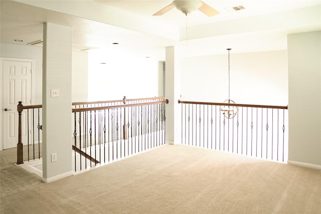 carpeted empty room with ceiling fan