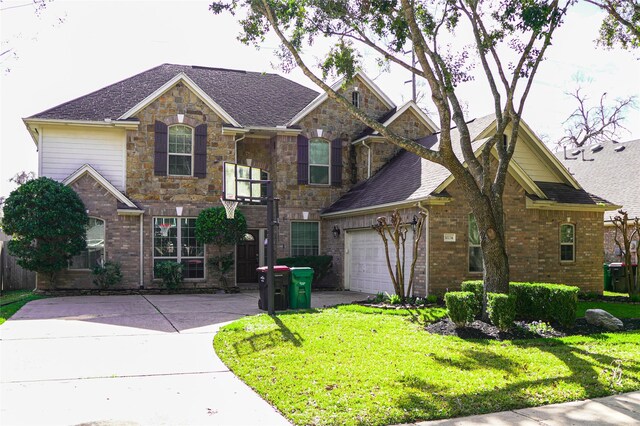 view of front of property featuring driveway, brick siding, stone siding, and a front yard