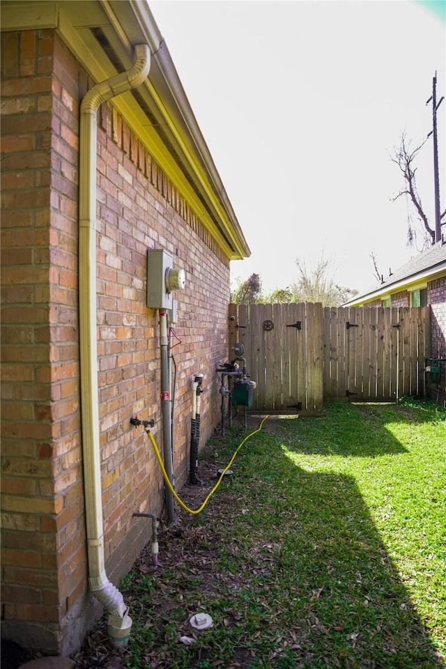 view of home's exterior with a yard