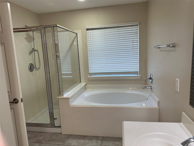 bathroom featuring tile patterned flooring and independent shower and bath