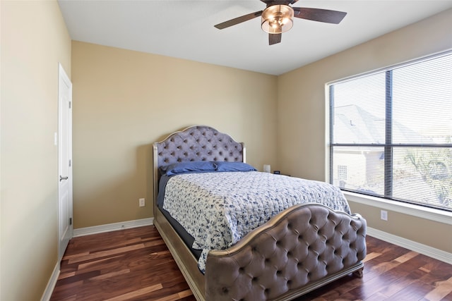 bedroom featuring dark wood-type flooring and ceiling fan