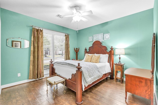 bedroom featuring dark hardwood / wood-style flooring and ceiling fan