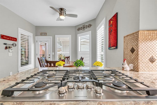 kitchen with stainless steel gas stovetop and ceiling fan