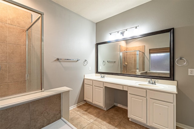 bathroom featuring tile patterned floors, walk in shower, and vanity