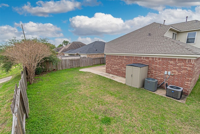 view of yard with cooling unit and a patio