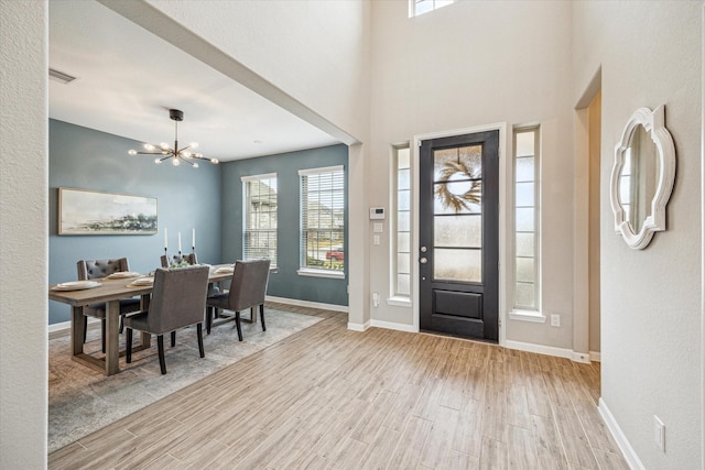 foyer entrance with an inviting chandelier