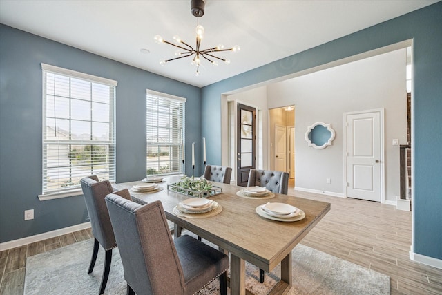 dining area featuring an inviting chandelier