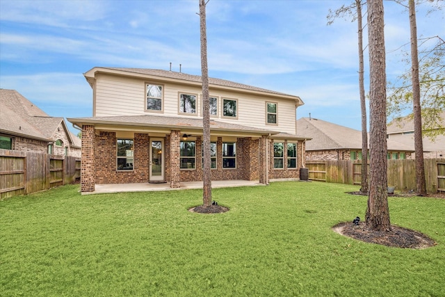 back of property featuring a patio and a lawn