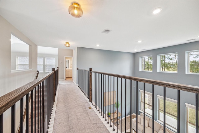 hallway with light carpet