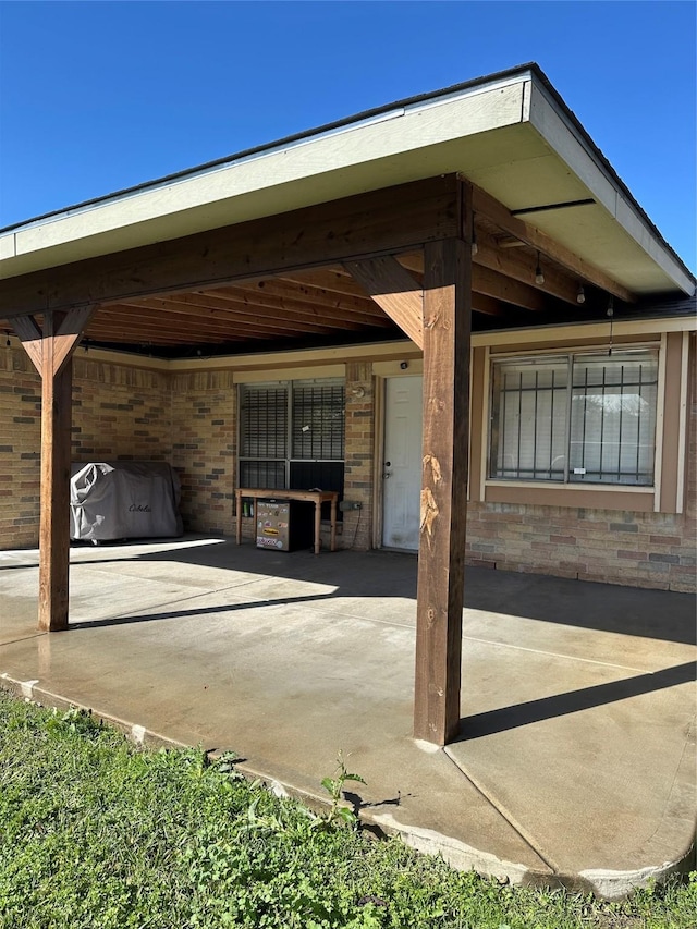 view of patio featuring a grill