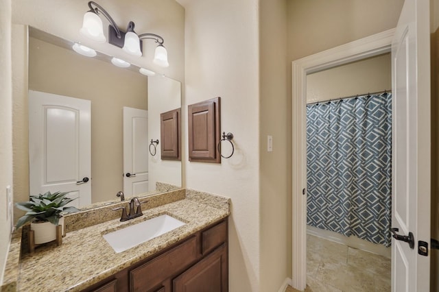 bathroom with vanity and curtained shower